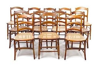 * An Assembled Set of Twelve Empire Oak Side Chairs Height 31 1/2 inches.