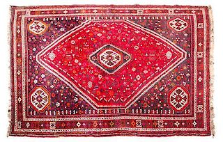 * A Northwest Persian Wool Rug 9 feet 10 inches x 7 feet 5 inches.