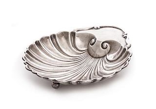 An American Silver Dish, Mueck-Carey Co., New York, NY, of shell form with three spherical feet