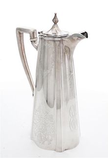 An American Silver Coffee Pot, , having a hinged lid with urn finial, body with brite cut decoration and monogram, handle with i