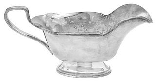 An American Silver-plate Sauce Boat, 20th Century, with shaped reeded rim and angular handle