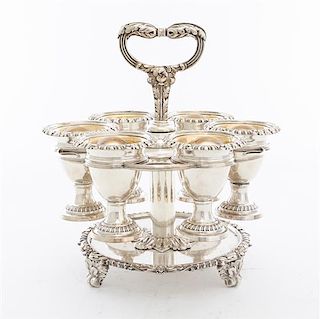 * A Sheffield-plate Egg Cup Set, Mappin Bros, Sheffield, Early 20th Century, comprising a stand with six cups, each cup having d