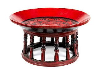 * A Chinese Red Painted Low Table Diameter 19 1/2 inches.