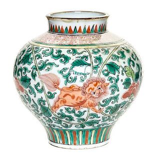 A Wucai Porcelain Jar Height 5 3/4 inches.