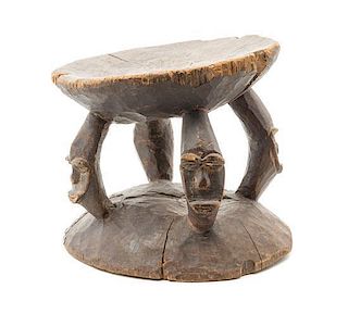 * A New Guinea Carved Wood Stool Height 10 1/2 inches.