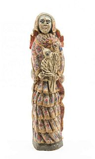 A Brazilian Polychromed Wood Figural Group Height 18 inches.