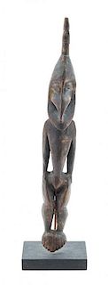 * A New Guinean Carved Figural Element Height 9 3/4 inches.