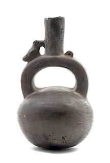 * A Pre-Columbian Pottery Stirrup Vessel Height 6 1/2 inches.