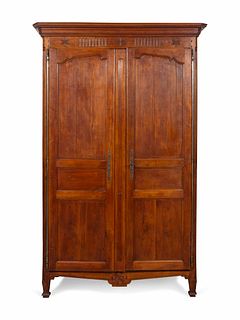 A French Provincial Carved Walnut Armoire