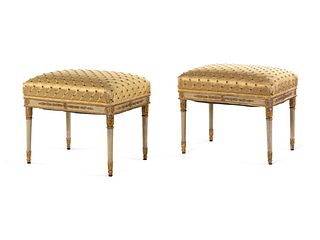 A Pair of Italian White-Painted and Parcel Gilt Carved Benches