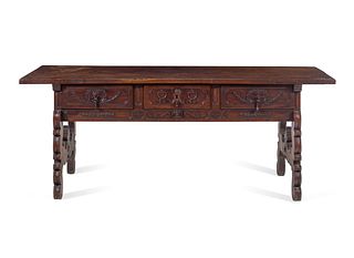 A Continental Carved Walnut Trestle Table