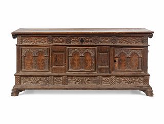 A Continental Carved and Inlaid Walnut Coffer