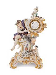 A German Painted and Parcel Gilt Porcelain Figural Mantel Clock