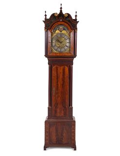 A George III Carved and Figured Mahogany Tall Case Clock