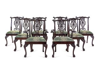 A Set of Eight George III Carved Mahogany Ribbon-Back Dining Chairs