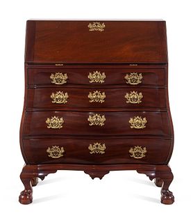 A Chippendale Style Carved Mahogany Bombe-Form Slant-Front Desk