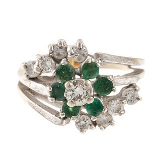 An Emerald & Diamond Cluster Ring in 14K