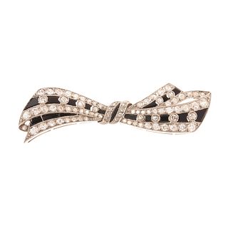 An Art Deco Diamond & Bl Onyx Bow Pin in Platinum