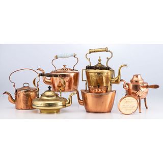 A Group of Copper and Brass Kettles 