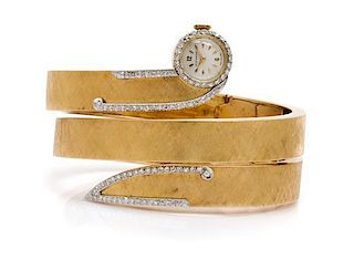 An 18 Karat Yellow Gold and Diamond Wraparound Bracelet Wristwatch, 59.50 dwts.