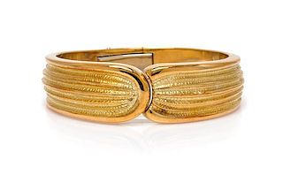 An 18 Karat Textured Yellow Gold Bangle Bracelet, 40.10 dwts.