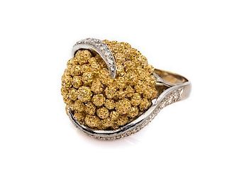 An 18 Karat Two Tone Gold and Diamond Ring, 15.00 dwts.