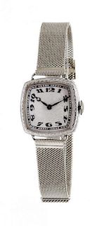 A Platinum, 18 Karat White Gold and Diamond Wristwatch, 14.90 dwts.