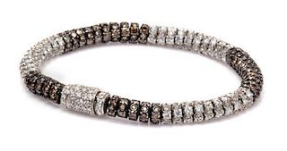 An 18 Karat White Gold, Colored Diamond and Diamond Bracelet, 18.00 dwts.