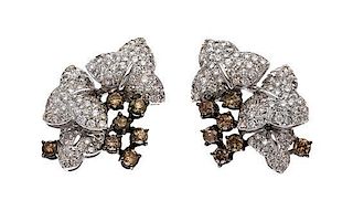 A Pair of 18 Karat White Gold, Colored Diamond and Diamond Earclips, 13.70 dwts.