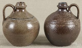 Two North Carolina Jugtown Pottery small jugs, 20th c., each bearing an incised mark on the base, 5 1/2'' h.
