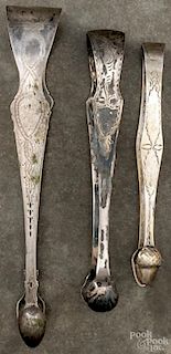 Three unmarked silver sugar tongs, 19th c., 4 ozt.