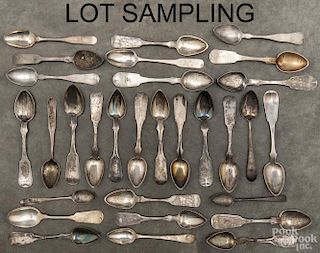 Coin silver spoons, 19th c., of various makers, to include O. Conrad, Lescure, I. Reed & Son