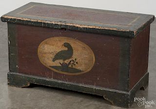 Painted pine blanket chest, early 19th c., retaining its original decoration with a central vignette