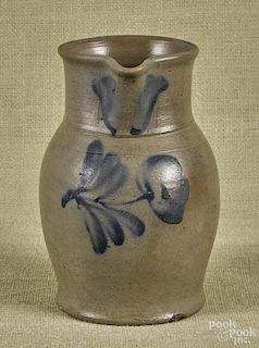 Pennsylvania salt glazed stoneware pitcher, 19th c., with cobalt floral decoration, 9 1/4'' h.