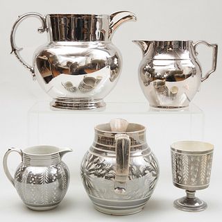 Group of Four Silver Lustreware Pitchers