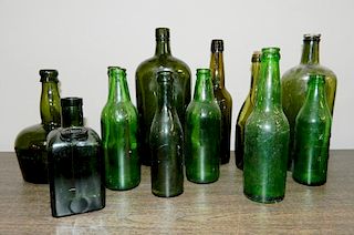 12 Antique bottles in green
