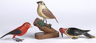 Three painted wood and metal birds