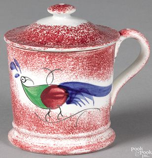 Red spatter lidded mug with peafowl