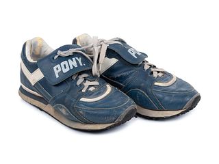 A Pair of Greg Maddux Game Used Pony Cleats,
