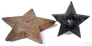 Two cast iron star windmill weights