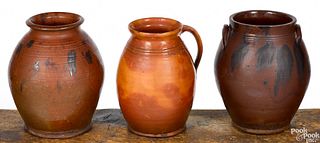 Two New England redware crocks and a pitcher