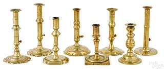 Eight English brass candlesticks, 18th c.