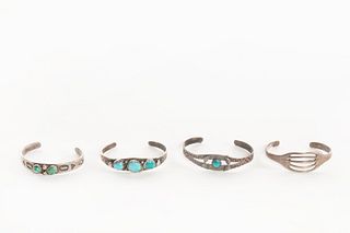 A Group of Four Navajo Silver and Turquoise Child's Bracelets