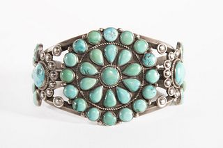 Navajo, E. Yazzie, A Silver and Turquoise Cluster Bracelet, 1947