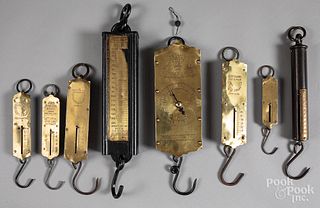 Eight early brass and iron scales.