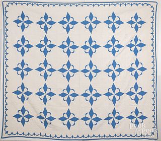 Two blue and white pieced quilts