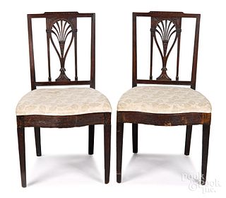 Pair of carved mahogany racquetback dining chairs