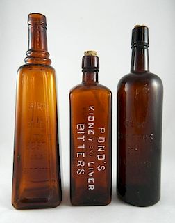 3 Amber bitters bottles