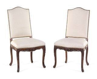 A Pair of Louis XV Style Carved Walnut Side Chairs