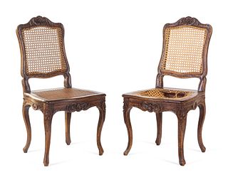 A Pair of Louis XV Carved Walnut Side Chairs